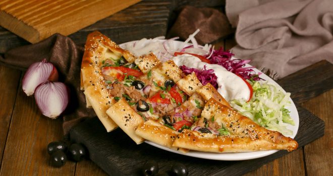 turkish-pide-with-olives-and-tomatoes-on-wooden-board